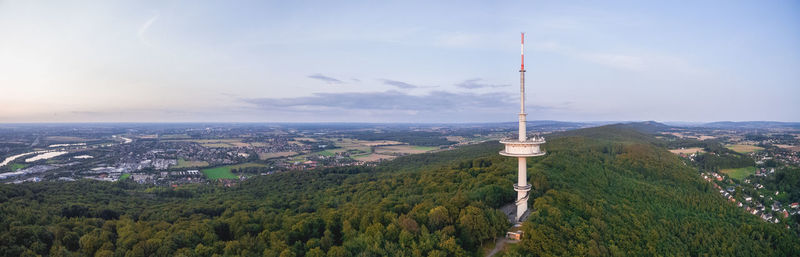 Aerial view of trees and buildings against sky