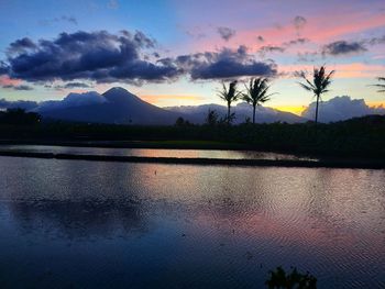 Scenic view of lake against sky during sunset