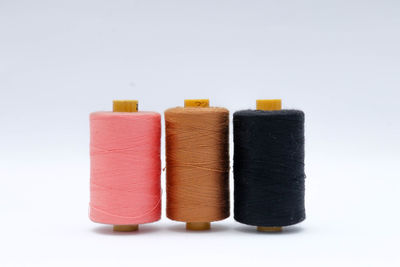 High angle view of thread spool on white background