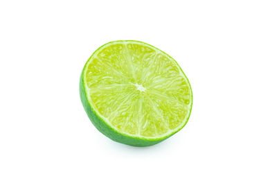 Close-up of lemon slice against white background