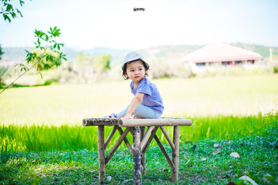 Portrait of boy on field
