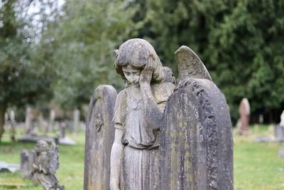 Angel headstone in a grave yard 