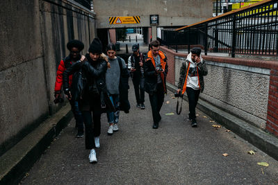 People walking on street in city