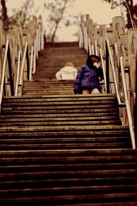 Low angle view of boy on stairs