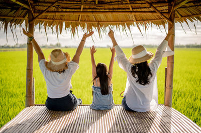 Rear view of women sitting in park