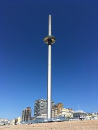 Low angle view of buildings against blue sky