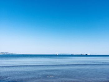Scenic view of sea against clear blue sky