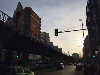 Vehicles on road along buildings