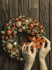 Woman makes a fir wreath for advent. christmas eve and decorating. new year