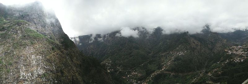 Scenic view of tree mountains against sky