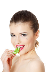 Portrait of young woman against white background