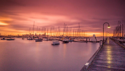 Boats moored at harbor