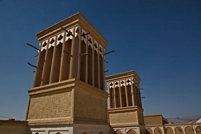 Low angle view of building against blue sky