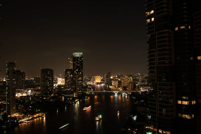 Illuminated buildings in city at night