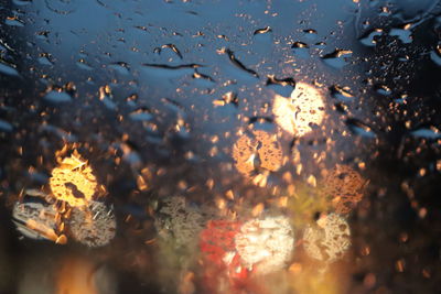 Full frame shot of raindrops on glass window