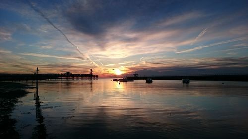 Scenic view of dramatic sky over sea during sunset