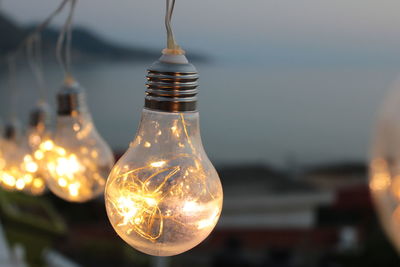 Close-up of illuminated light bulb