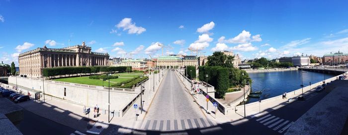 Panoramic view of town against blue sky