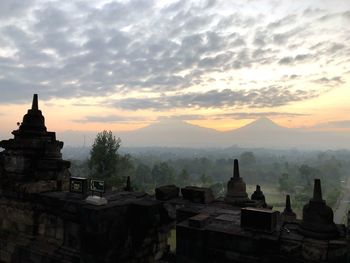 Historic building against sky during sunset