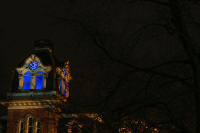 Low angle view of illuminated christmas tree at night