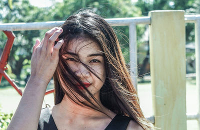 Portrait of young woman in park