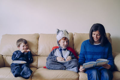 Family sitting on sofa