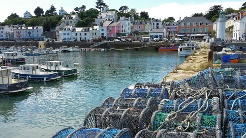 Boats moored at harbor