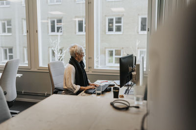 Woman sitting at desk in office