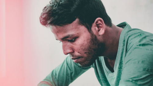 Portrait of young man looking away