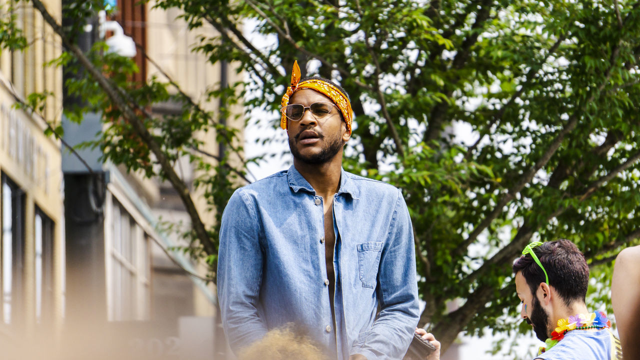 real people, casual clothing, young adult, leisure activity, men, lifestyles, young men, tree, standing, plant, males, day, people, portrait, front view, low angle view, looking, adult, outdoors