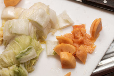 High angle view of chopped fish in plate on table