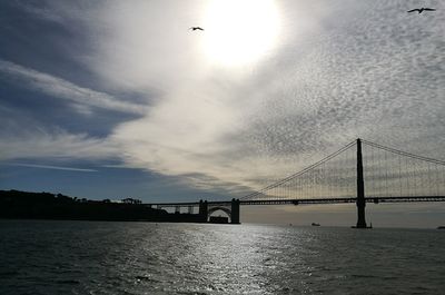 Bridge over sea against sky