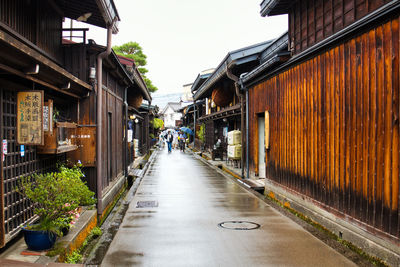 Street amidst buildings in city against clear sky