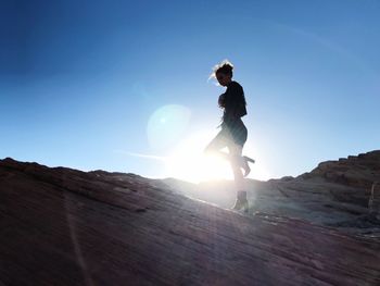 Full length of woman against clear sky