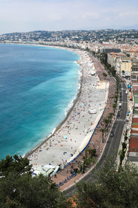 High angle view of sea and buildings against sky