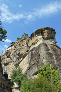 Low angle view of rock formations against sky