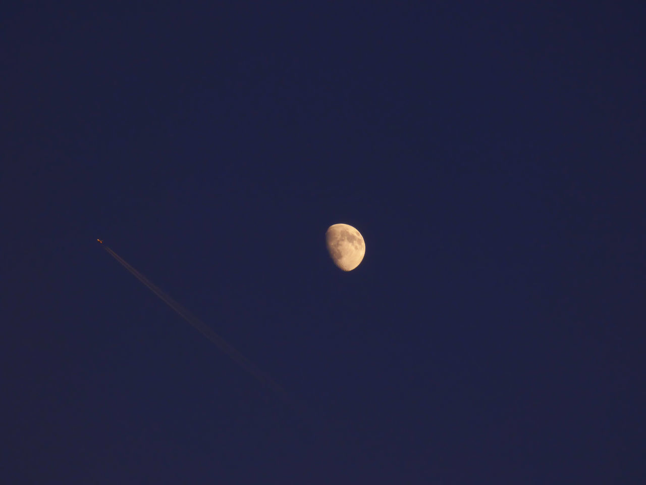 Airplane flying near the moon