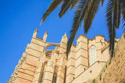 Low angle view of building against blue sky