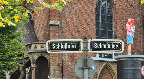 Information sign on wall in city