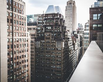 Modern buildings in city against sky