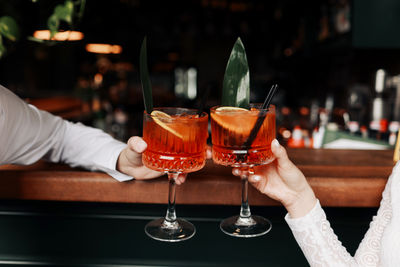 Cropped hand of woman holding wineglass