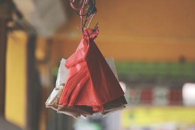 Close-up of red hanging outdoors