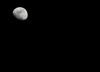 Scenic view of moon against clear sky at night