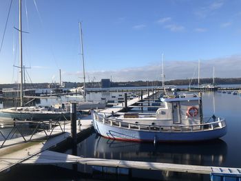 Boats moored at harbor