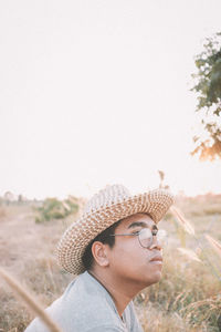 Portrait of man wearing hat against sky