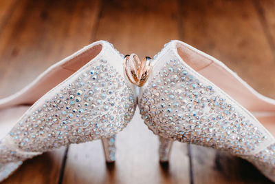 Close up of wedding shoes and rings