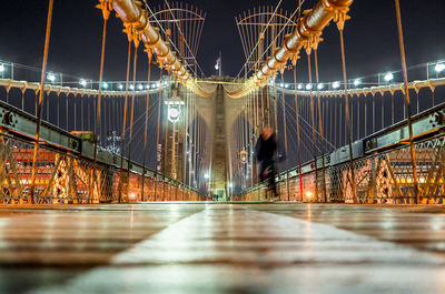 Illuminated suspension bridge at night