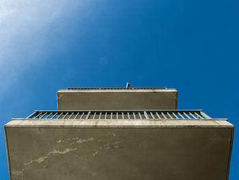 Low angle view of building against clear blue sky