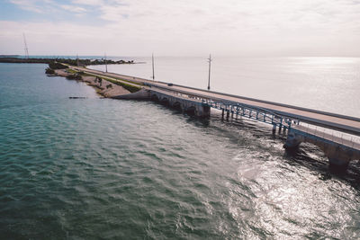 Pier over sea against sky