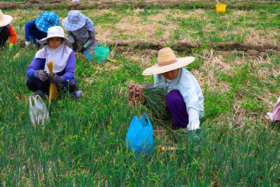 People working in farm against sky